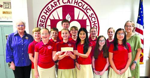 CDA No. 1962 recently made a donation toward the sixth grade end of year social at Sacred Heart School.