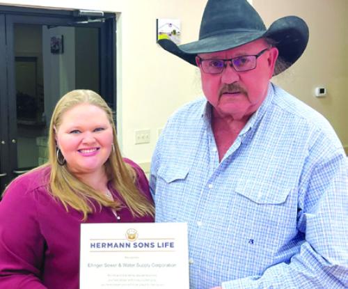 Samantha Kelley VP and COO presented Greg Hunger on behalf of the Ellinger Sewer and Water Corporation the Humanitarian award.