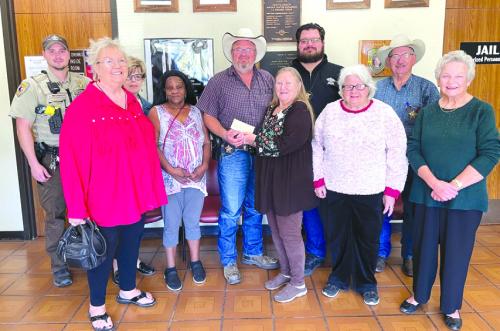 The Walhalla Extension Education Club members recently donated to Fayette County’s Deputy Santa Fund. Shown in the photo are Walhalla Club members and personnel from the Fayette County Sheriff’s Department. From left to right: Deputy Jared Michalec, Vivian Krenek, Sally Garrett, Shirley Davis, Lt. David Beyer, Donna Burton, Investigator Jeremy Castleberry, Helen Wagner, Chief Deputy Randy Noviskie, and Lila Garlin.