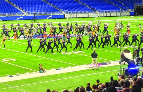 LG grad Jonathan Delgadillo and the Genesis Drum and Bugle Corps performing at the Alamodome. Photo by MaKenzie Givan