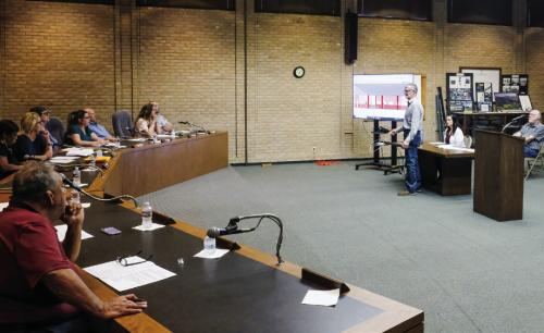Fayette County Fair Association President Michael Zuhn (standing) spoke to the La Grange City Council Monday night about plans to replace the old German-Czech Mart at the Fairgrounds. Photo by Andy Behlen