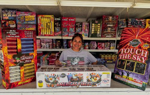 The Mr. B Fireworks stand on the Bluff south of La Grange opened Tuesday, June 30. Stand operator Blanca Villanueva is pictured above with some of the most spectacular fireworks bundles available for purchase. The America’s Finest package, in the center, features 108 shots for a price of $239. She called it “the most bang for your buck.” Photo by Andy Behlen