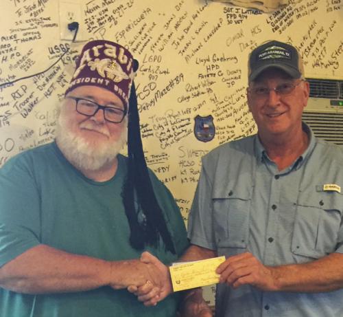 Carmine Lion President, Ricky Weyand, right, presented two donations totaling $1,000 to Mike Thorpe, President of the Brenham Shrine Club recently.