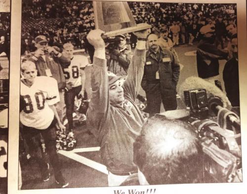 La Grange head coach Tony Valastro holds up the state title trophy. Record fi le photo