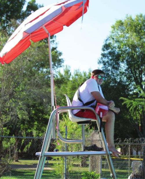 La Grange Lifeguard Tyson Roscher keeps his eyes on the pool.