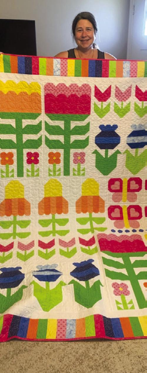 A local resident, Steve Kana from Schulenburg, is the 2026 Winner of The Best Little Quilt Show Raffle Quilt. Carol Kana pictured with “Flower Power”.