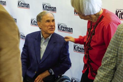Texas Governor Greg Abbott speaks with a voter after delivering his remarks on Thursday. Photo by Andy Behlen
