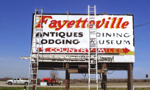 Years ago, Homer Allen painted the well-known Fayetteville sign on Highway 71.