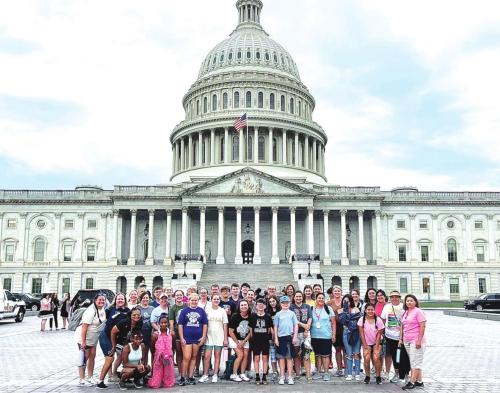 Local students and their chaperones in front of the US Capitol building.