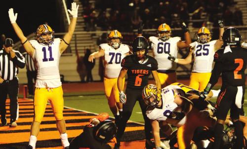 His teammates celebrate the touchdown as Ryder Imhoff crosses the goal line for a early touchdown Friday. Photo by Darrell D. Gest