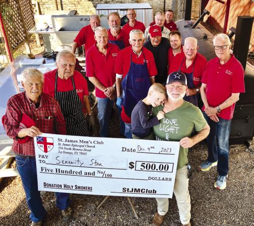 The Holy Smokers recently held a barbecue benefiting Serenity Star of Bastrop. Pictured front from left are: Dan Boyles, Sawyer Jones, Tut Jones, Director; middle row: Richard Dixon, Guy Mason, Jim Gilley, Tom Tracy, Jason Krupala, Bill Rugeley, and Jim Austin; back row: Mike Parrish, Larry Kahanek, Trey Cheatham, Paul Crane, and Brad Gibson.