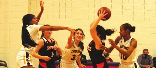 The La Grange defense, in this photo Ariel Thompson, Keslyn Davis and Aysia Grant, didn’t give Smithville any time to relax Friday. Photo by Jeff Wick
