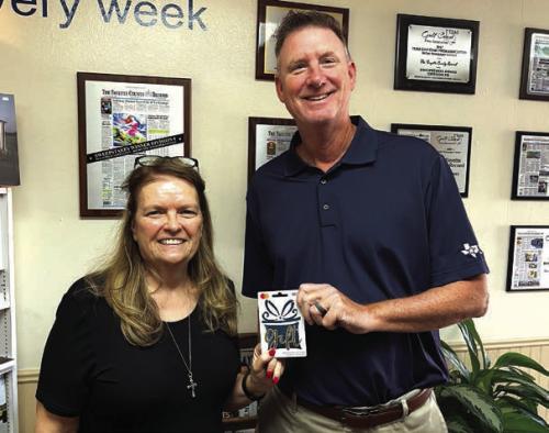David Cooper of La Grange was the first $100 winner in our Fayette County Record reader Football Pick-It contest of the year after picking all 10 games correctly. He is shown here accepting the $100 gift card from publisher Regina Keilers, left. The ballot appears in the Record every Tuesday during the season.