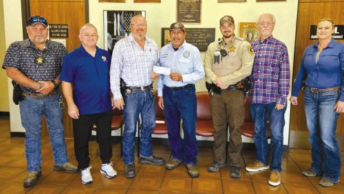The Knights of Columbus Council No. 2574 presented a $500 check to the Deputy Santa Program. Pictured from left is: Investigator Marc Bennet, Marcus Recek (KC Financial Secretary), Lt. David Beyer, Hector Cervantez (Grand Knight), Deputy Jared Michalec, Garry Schellberg (Treasurer), and Sgt. Angela Lala.