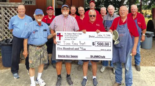 The St. James Men’s Club Holy Smokers recently cooked for the Fayette County Texas Ramp Project. Pictured second and fourth from left is John Marburger and Frank Smith of the Fayette County Texas Ramp Project surrounded by men of the Holy Smokers.