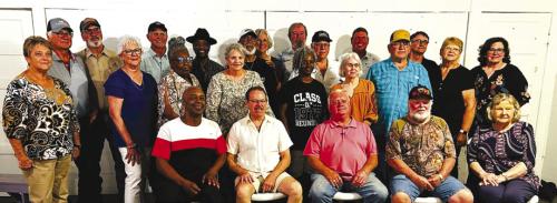 Pictured are (front row, seated) Donald Ray Jackson, Father Eddie Winkler, Jackie Machac, Patrick Chaloupka, Margie Beck Mueller, (middle row) Audrey Guentert Kristynik, Verlene Dittrich Ulrich, Janice Nunn Russell, Martha Sheldon Hare, LaVera McMillian Howard, Connie Matula Taylor, Larry Pavlicek, (back) Ronnie Orsak, Mike Olle, Chris Cernosek, Willie Matthews, Randy Houston, Lora Janacek Petty, Ken Goppert, Allen Vornsand, James Anderle, Gordon Bretting, Glenda Getschmann Munsch, and Ginger Holub Tilicek.