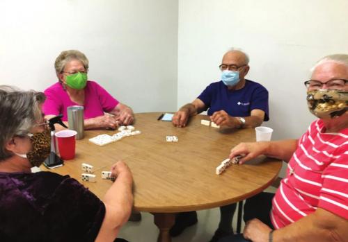 Pictured are Elroy Dieringer, Betty Gabler, Carolyn Moore and Irene Janda who showed up to play dominos at NVCC last monday.