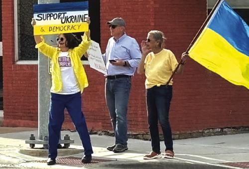 Supporters take stand for Ukraine. From left to right: Kathleen McShane, Matt Holdeman, and Rebecca Hegar.