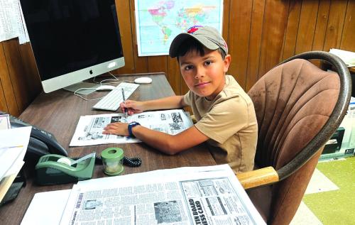 After catching an error in a recent edition of the The Fayette County Record, 10-year-old La Grange homeschooler Lou McCain volunteered his services as a proofreader for this edition of the newspaper. Shown here is Lou at a desk at the newspaper office correcting pages Wednesday afternoon. We think you will agree that this may be the cleanest edition of The Record yet. Thanks Lou! And you are welcome back anytime.