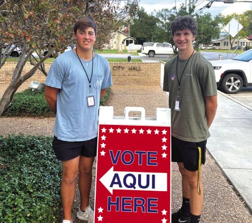 La Grange high school seniors Will Bundick and Josh Behlen worked as clerks on election day at La Grange City Hall. Photo courtesy of Julie Bundick
