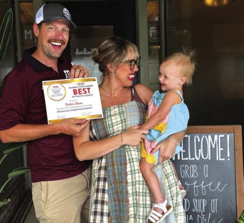 Taylor Swenning, her husband Chris and one of their two daughters.