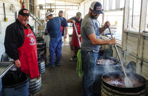 Schulenburg volunteer firefighters tend to their steaming kettles of beef stew for the Firemen’s Benefit Supper at the Schulenburg KC Hall Thursday. Pictured (from left) are firemen Darren Florus, Asst. Chief Gary Eudy, Brayson Florus, Frank Wick III, and Jarred Willbanks. Photo by Andy Behlen
