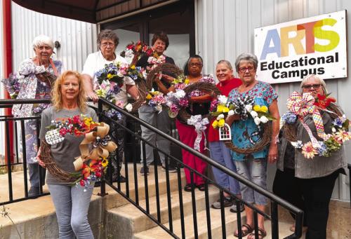 April at Artful Fridays at Arts For Rural Texas reflects the season of spring. Sheryl Tumis is teaching a Floral Design workshop. Her students created these lovely wreaths just in time for Easter. Pictured are Mary Ann Jurica, Jody Driskel, Leona Lange, Delores Bitner, Janice Collins, Annette Jasek, Sheryl Tumis, and Kathy Carpenter.