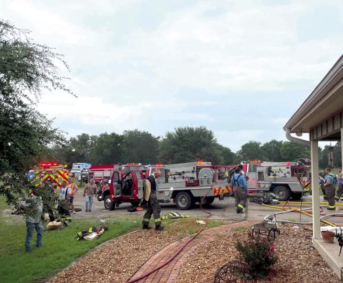 The Schulenburg Volunteer Fire Department saved a house that caught fire east of Schulenburg Tuesday afternoon. The home suffered damage, however. A benefit fund has been set up at Fayette Savings Bank to assist homeowner Judy Kubenka with repairs. Photo courtesy of the Schulenburg Volunteer Fire Department