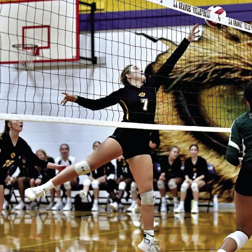 La Grange’s Riley Youens hits the ball over against Taylor earlier in district play. The Lady Leps have gone 5-1 through the first half of district play. Photo by Stephanie Steinhauser