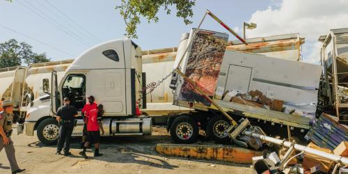 The impact of the train cut the trailer in half. The front part of the trailer and the cab spun around and took out the cross arm pole. Photos by Andy Behlen