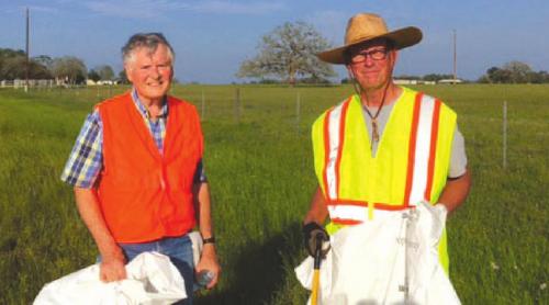 Jim Sula and Joe Lamer picking up trash along Hwy. 159.