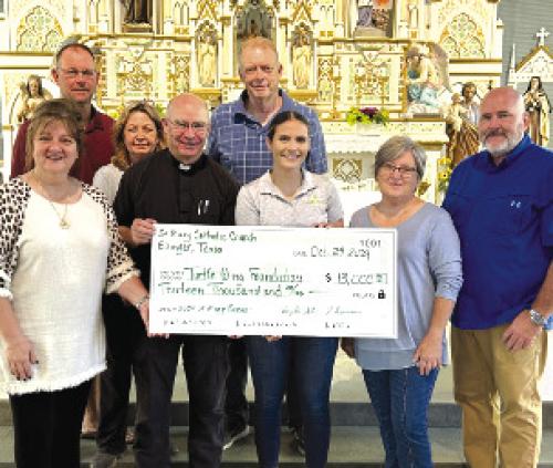 Destiny Siptak, Turtle Wing Foundation Executive Director, accepted the donation from St. Mary Catholic Church.