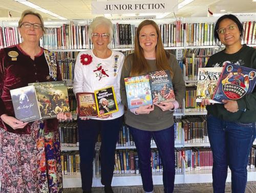 From left: Kim Joost, Smith-McMillan Chapter Librarian; Carolyn Caflisch, Smith-McMillan Chapter Regent; Allison MacKenzie Hollek, Fayette Public Library (La Grange) Director; Carol Perales, Fayette Public Library Youth Services Coordinator.