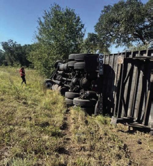 An 18-wheeler rolled on its side after swerving to avoid a head-on collision on SH 237 near Hills Rd. last Tuesday.