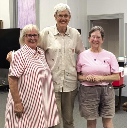 Susan Schultz, middle, and Mary Lou McElroy, right, from the AMEN Food Pantry In La Grange are pictured with Leonita Sanders, left, president of MLLC WELCA. They were presented with 231 pounds of food and a $1,250 monetary donation for the food pantry at the WELCA Salad Supper in Carmine.