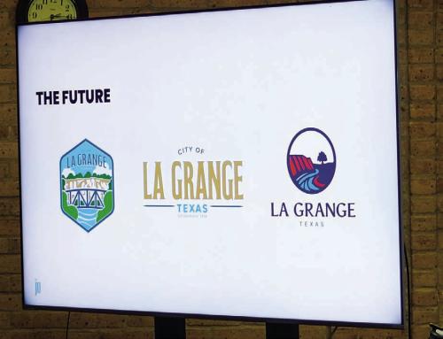 La Grange City Council considered three options for a new town logo at their meeting Monday night. The Council picked the one on the left – a shield depicting the Bluff and a bridge across the Colorado River surrounded by trees and a blue skyline. Photo by Andy Behlen