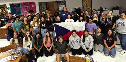 The high school Leo club members with Texas Czech Heritage and Cultural Center manager Mark Hermes during his visit to the school.