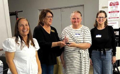Ystation, owned by Len Peters, was named Business of the Year at the Carmine Chamber of Commerce Mixer on Feb. 27. Pictured accepting the award from Marlene Waak are Melanie Rauch and Amy Nini. Courtney Kieke, Chamber president, is also pictured on the left.