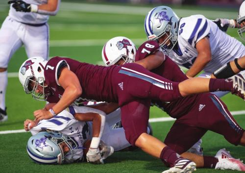 Dayton Cliffe makes the tackle with assistance from Oscar Romero for Flatonia in Friday night’s homecoming victory. Photo by Stephanie Steinhauser