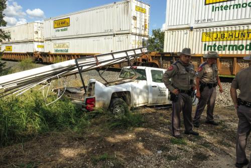 A train struck a pickup truck at a private crossing north of Winchester Wednesday afternoon. The driver and passenger escaped without serious injury. Photo by Andy Behlen