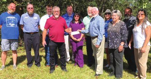 Harvey House Donation Made to Habitat
