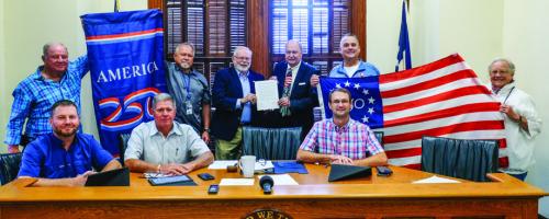 Fayette County Commissioners Court signed a resolution establishing the Fayette County Semiquincentennial Commission and appointed Larry Jackson as the chairman of the Commission’s executive committee. Pictured (back, from left) are Commission members Bob Heinrich, Jesse Lednicky, Larry Jackson, County Judge Dan Mueller, Michael Schlabach, Sally Reynolds, (seated) Pct. 4 Commissioner Drew Brossmann, Pct. 3 Commissioner Harvey Berckenhoff, and Pct. 2 Commissioner Clint Sternadel. Photo by Andy Behlen