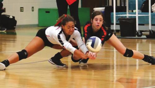 Schulenburg’s Kieryn Adams (left) and Claire Antosh (right) both make sure this hit from Thrall doesn’t hit the floor in Saturday’s regional final. Photo by Audrey Kristynik