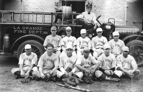 The La Grange Fire Department’s baseball team poses in front of an early fire engine and the Old Casino Hall, which had recently been converted from La Grange High School to a fire station. None of the men have been identified. Photo courtesy of the Fayette Heritage Museum and Archives