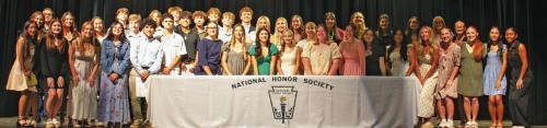 The new and returning members of the La Grange High School Chapter of the The National Honor Society, pose on stage at the conclusion of the Sept, 10 induction ceremony at the school’s Performing Arts Center. Photo by Lucy Carr