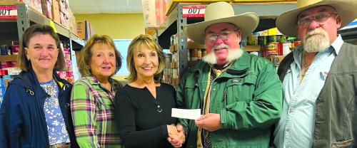 The Colorado River Trail Riders Association of Weimar, recently donated $500 to the Schulenburg Area Food Pantry. Pictured are Tina Kiker, trail rider member, Joyce Canada and Veronica Smith, both pantry volunteers, Cary Hackler and Mike Henke, both trail rider member.