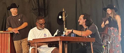Left to right: Kyle Hartmann, Gregory Rhodes, Garrett Reavis and Emily Hudson rehearse a scene.
