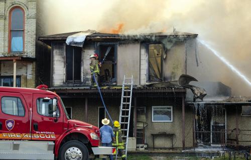 Gary Hoover’s home and personal library burned in downtown Flatonia on Monday. The building formerly housed the Flatonia Community Clinic. Photo by Andy Behlen