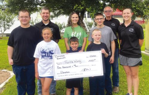 The Incredible Knockouts donated to the Turtle Wing Foundation. Pictured are Samuel Mac-Donald, Edward Kozel, Hannah Bartos, Destiny Psencik of Turtle Wing, Lukas Bartos, Callan MacDonald, Daniel MacDonald, Charlie Bartos and Megan Bartos.
