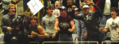 Fayetteville students fans cheering from the front row when a TV crew came by.